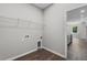 Functional laundry room showcasing storage solutions and connectivity for modern appliances at 4502 Fairway Oaks Dr, Mulberry, FL 33860