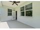 Covered patio showcasing seamless indoor-outdoor transition with multiple windows and outdoor access at 4502 Fairway Oaks Dr, Mulberry, FL 33860
