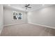 Spacious bedroom with carpet, ceiling fan and a bright window view at 4537 Fairway Oaks Dr, Mulberry, FL 33860