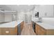 Modern kitchen featuring wood cabinets, island, white countertops, and stainless steel appliances at 4537 Fairway Oaks Dr, Mulberry, FL 33860