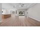 Spacious living room with hardwood floors, modern ceiling fan, and sliding glass doors leading to the outdoor space at 4537 Fairway Oaks Dr, Mulberry, FL 33860