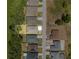Aerial view showcases the home's lot and neighborhood near a pond at 4541 Fairway Oaks Dr, Mulberry, FL 33860