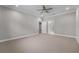 Spacious bedroom with carpet, ceiling fan and multiple doorways at 4541 Fairway Oaks Dr, Mulberry, FL 33860