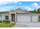 Charming single-story home with a two-car garage and well-maintained landscaping at 4541 Fairway Oaks Dr, Mulberry, FL 33860
