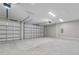Spacious three-car garage with high ceilings, offering ample parking and storage space at 4541 Fairway Oaks Dr, Mulberry, FL 33860