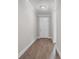 Hallway features wood-look floors, decorative trim, and neutral paint at 4541 Fairway Oaks Dr, Mulberry, FL 33860