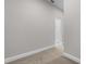 Neutral hallway with carpet flooring and white trim leading to a doorway at 4541 Fairway Oaks Dr, Mulberry, FL 33860