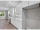 Bright kitchen featuring white cabinets and stainless steel appliances at 4541 Fairway Oaks Dr, Mulberry, FL 33860