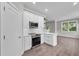 Modern kitchen with stainless steel appliances, oven, microwave, and island at 4541 Fairway Oaks Dr, Mulberry, FL 33860