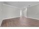 Spacious living room featuring elegant trim work, gray walls, and wood-look flooring at 4541 Fairway Oaks Dr, Mulberry, FL 33860