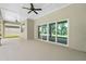 Large covered patio with sliding glass doors, perfect for seamless indoor-outdoor living and entertaining at 4541 Fairway Oaks Dr, Mulberry, FL 33860