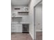 Stylish wet bar featuring marble counters, wine cooler, and floating shelves, perfect for entertaining guests at 4541 Fairway Oaks Dr, Mulberry, FL 33860