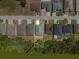 A straight down aerial view shows a single-Gathering home bordered by a pond and mature trees at 4545 Fairway Oaks Dr, Mulberry, FL 33860