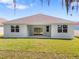 A view of the backyard and covered patio, showcasing the outdoor living space at 4545 Fairway Oaks Dr, Mulberry, FL 33860