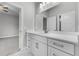 Bathroom vanity with white countertop, gray drawers, and hexagon tile flooring at 4545 Fairway Oaks Dr, Mulberry, FL 33860