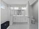 Beautiful bathroom features a dual sink vanity, shower and toilet at 4545 Fairway Oaks Dr, Mulberry, FL 33860