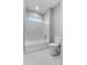 Bright bathroom with white tiled shower-tub, hexagon tile floor, and recessed lighting at 4545 Fairway Oaks Dr, Mulberry, FL 33860