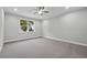 Bedroom featuring ceiling fan, recessed lighting, and large window at 4545 Fairway Oaks Dr, Mulberry, FL 33860