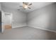Neutral bedroom featuring carpeted floor and ceiling fan at 4545 Fairway Oaks Dr, Mulberry, FL 33860