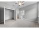 Bedroom featuring carpet, ceiling fan, closet and ensuite bathroom at 4545 Fairway Oaks Dr, Mulberry, FL 33860