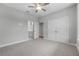 Bedroom featuring carpeted floor, closet and ensuite bathroom at 4545 Fairway Oaks Dr, Mulberry, FL 33860