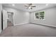 Bedroom features ceiling fan, recessed lighting, and large window at 4545 Fairway Oaks Dr, Mulberry, FL 33860