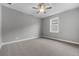 Carpeted bedroom with ceiling fan and window at 4545 Fairway Oaks Dr, Mulberry, FL 33860