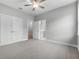 Bedroom with carpet, ceiling fan, closet and ensuite bathroom at 4545 Fairway Oaks Dr, Mulberry, FL 33860
