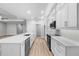 Modern kitchen with large island, stainless appliances, and hardwood floors at 4545 Fairway Oaks Dr, Mulberry, FL 33860