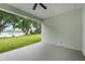 Covered lanai with serene lake views and plenty of room for outdoor living at 4545 Fairway Oaks Dr, Mulberry, FL 33860