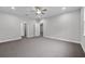 Spacious living room area shows doorways to other parts of the home at 4545 Fairway Oaks Dr, Mulberry, FL 33860