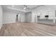 Spacious living room with hardwood floors, ceiling fan, recessed lighting, and open floor plan at 4545 Fairway Oaks Dr, Mulberry, FL 33860