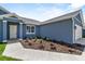 A close up of the front of a house with a well manicured lawn at 4550 Fairway Oaks Dr, Mulberry, FL 33860