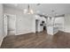 Spacious open-concept living space showcasing hardwood floors, sleek appliances, and an eat-in kitchen at 4550 Fairway Oaks Dr, Mulberry, FL 33860