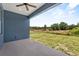 Covered patio offering serene views of lush greenery and outdoor space at 4550 Fairway Oaks Dr, Mulberry, FL 33860