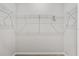 Walk-in closet showcasing white metal shelving, perfect for organized storage solutions at 4550 Fairway Oaks Dr, Mulberry, FL 33860