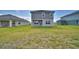 Backyard view of house featuring a covered patio at 4646 Grandview Glen Dr, Auburndale, FL 33823