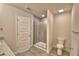 Bathroom with a tiled walk-in shower with a glass door at 4646 Grandview Glen Dr, Auburndale, FL 33823