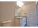 Stylish bathroom featuring granite counters, white cabinets, and a modern faucet at 4646 Grandview Glen Dr, Auburndale, FL 33823