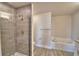 Bathroom with tiled shower, separate tub and modern fixtures at 4646 Grandview Glen Dr, Auburndale, FL 33823