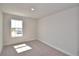 Cozy carpeted bedroom with a bright window, creating a comfortable space at 4646 Grandview Glen Dr, Auburndale, FL 33823
