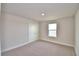 This bedroom showcases neutral walls, plush carpeting, and a well-lit interior with a window and large closet at 4646 Grandview Glen Dr, Auburndale, FL 33823
