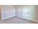 Bedroom featuring neutral walls, plush carpeting and a closet with double doors at 4646 Grandview Glen Dr, Auburndale, FL 33823