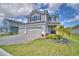Charming two-story home with a three-car garage and beautifully maintained lawn at 4646 Grandview Glen Dr, Auburndale, FL 33823