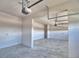 A bright garage space with an automatic garage door mechanism and ample storage at 4646 Grandview Glen Dr, Auburndale, FL 33823