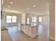 Open kitchen with granite island overlooking the spacious living area at 4646 Grandview Glen Dr, Auburndale, FL 33823