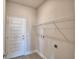 Functional laundry room with modern appliances connections, ample shelving, and a clean, organized space at 4646 Grandview Glen Dr, Auburndale, FL 33823