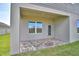 Covered patio area with brick pavers and well-maintained lawn at 4646 Grandview Glen Dr, Auburndale, FL 33823