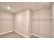 Walk-in closet complete with a wall-to-wall wire rack for storage at 4646 Grandview Glen Dr, Auburndale, FL 33823