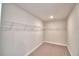 Walk-in closet complete with a wall-to-wall wire rack for storage at 4646 Grandview Glen Dr, Auburndale, FL 33823